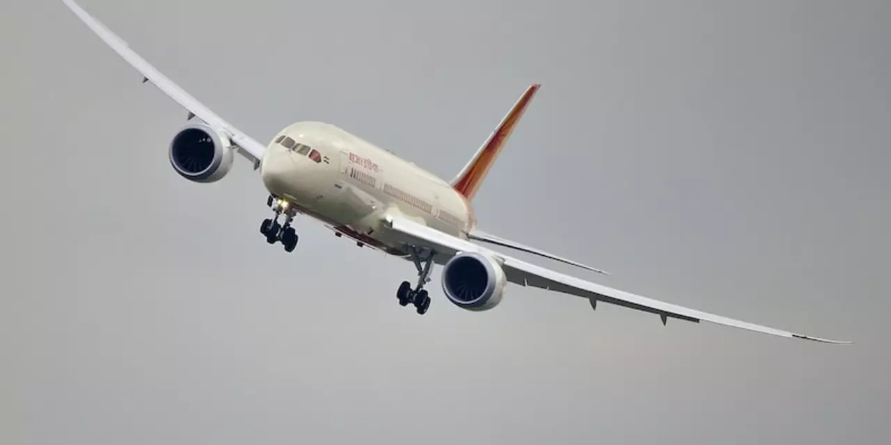Why is Air India under enormous debt and loss?